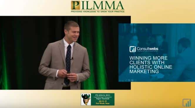 Man presents online marketing strategies at PILMMA conference, with Consultwebs slide in background.