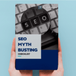Handheld seo guide debunking myths with highlighted keyboard keys on a light blue background.