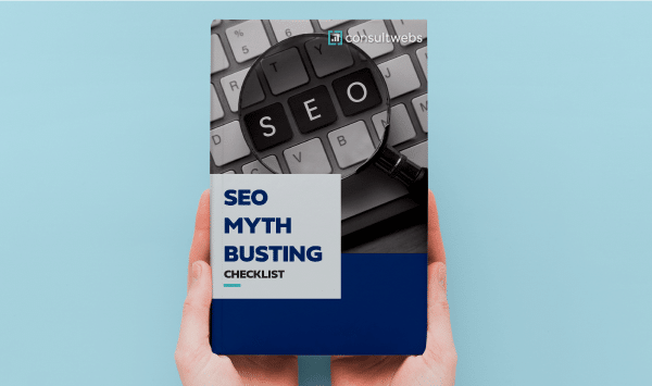 Handheld SEO guide debunking myths with highlighted keyboard keys on a light blue background.