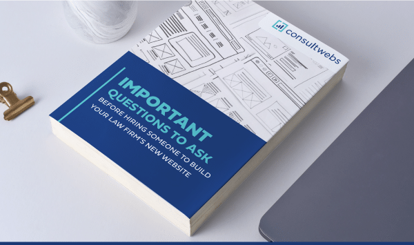 Closed book on modern workspace with laptop and personal items, titled 2020 Guide to Building Lasting Professional Relationships.