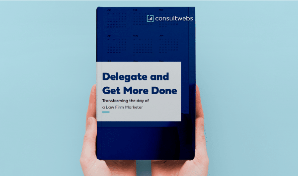 Hands holding smartphone with e-book on law firm marketing strategies, light blue background.