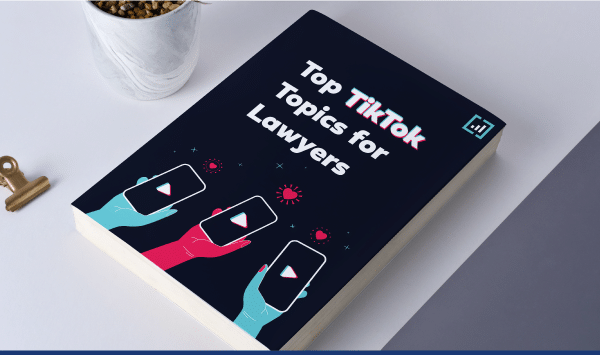 Book on tiktok strategies for lawyers with plant and vintage key on white background.