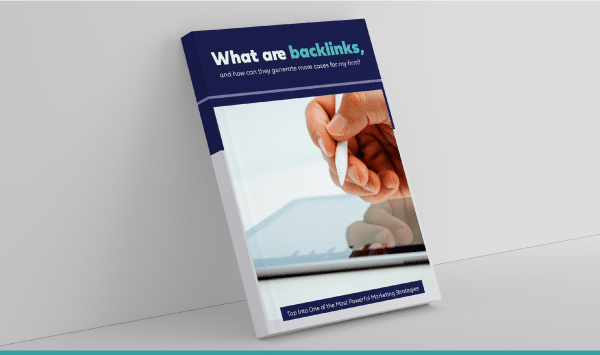 Booklet on SEO backlinks, Mastering SEO: Essential Guide, with a hand drawing a link symbol.