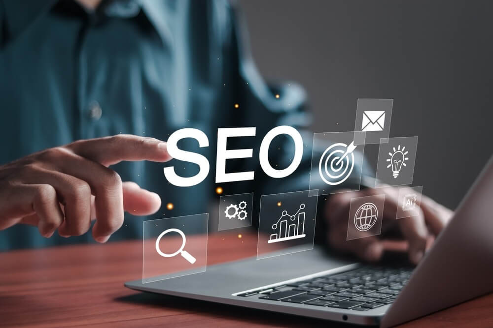 Businessman use SEO tools on laptop for promoting ranking traffic on website and optimizing website to rank in search engines.