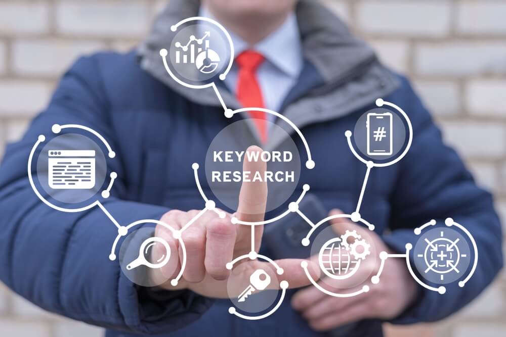 Man using virtual touch screen sees inscription: KEYWORDS RESEARCH